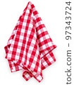 Hanging red checkered kitchen table towel isolated on white. Traditional picnic tablecloth. 97343724