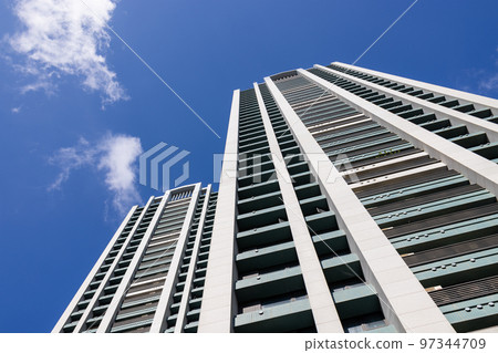 Low angle of apartment building over blue sky Low angle of apartment building over blue sky 97344709