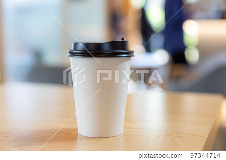 Paper hot coffee cup in cafe Paper hot coffee cup in cafe 97344714