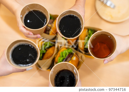 Paper cup with soft drink at party time 97344716