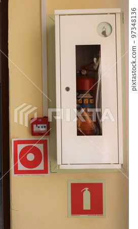 fire hydrant in a white cabinet on the wall with fire extinguisher sketchy symbols, fire fighting equipment in a closed container with a glass window fire hydrant in a white cabinet on the wall with fire extinguisher sketchy symbols, fire fighting equipment in a closed container with a glass window 97348136