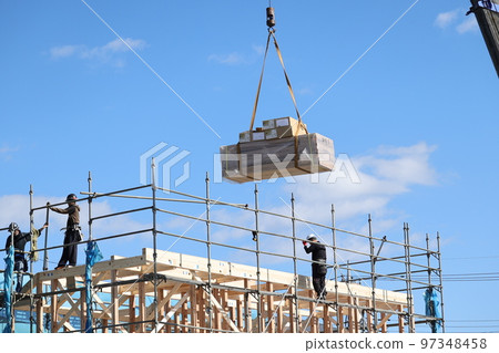 Crane work at a housing construction site Crane work at a housing construction site 97348458