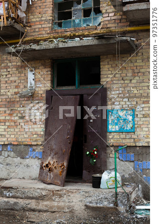 Building damaged by Russian bombardments. Building damaged by Russian bombardments. 97351776