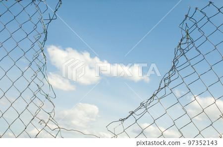 Broken metal mesh fence Broken metal mesh fence 97352143