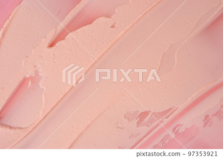 Pink cosmetic clay smudged background. Pink cosmetic texture macro background. Light red clay cosmetic mask textured smears close up. Cosmetic clay for face and body skin care procedures. 97353921