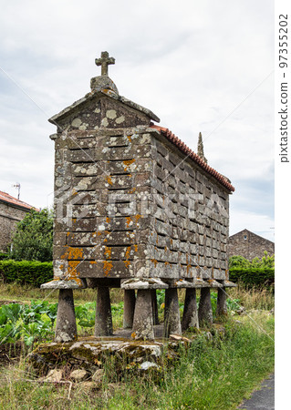 Beautiful village of Fisterra in Spain, unique for its horreos, traditional granary barns 97355202