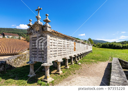 The long and narrow grain store, horreo at Carnota in Galicia, Spain. 97355220
