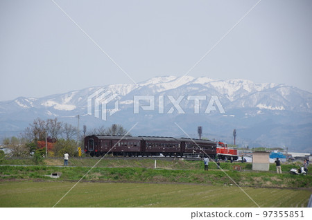 Aterazawa Line near Uzen Kanazawa Snowy mountains and an old passenger train 97355851