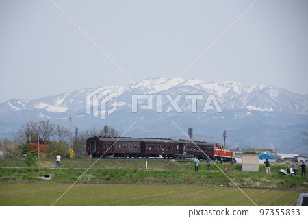 Aterazawa Line near Uzen Kanazawa Snowy mountains and an old passenger train 97355853