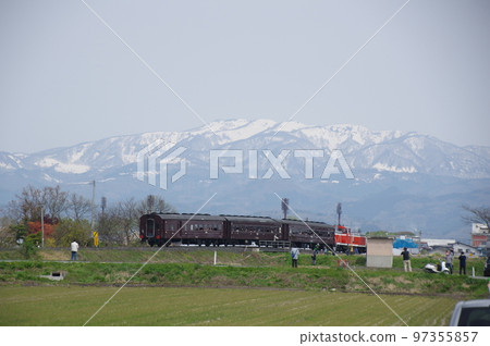 Aterazawa Line near Uzen Kanazawa Snowy mountains and an old passenger train 97355857