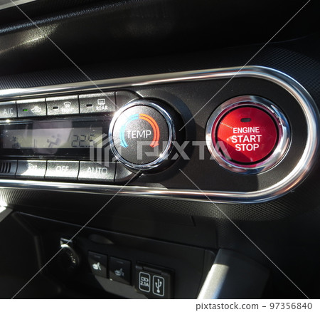 A button for starting or stopping the engine of a car 97356840