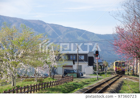 Yamagata Railway Train arriving at Nagai Station 97360723