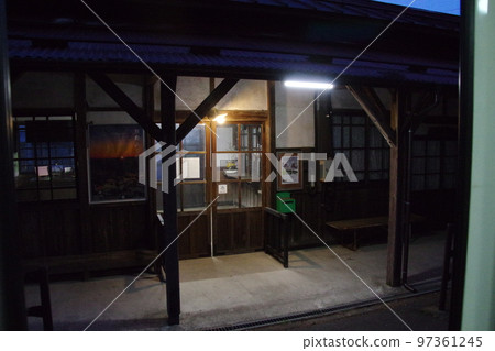 Yamagata Railway Uzen Narita Station building at dusk 97361245