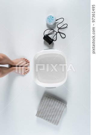 procedure of ionic detox foot bath machine in spa beauty center isolated procedure of ionic detox foot bath machine in spa beauty center isolated 97361495