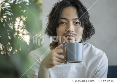 young man with a mug 97364640