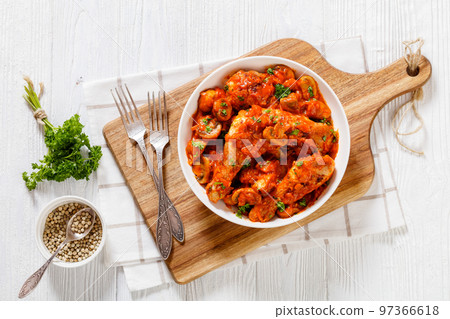 chicken stew with mushrooms in a tomato sauce chicken stew with mushrooms in a tomato sauce 97366618