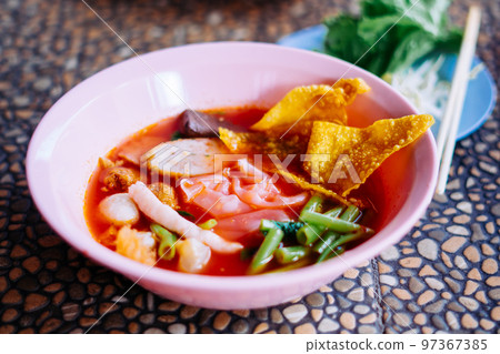 Close up of noodle in pink broth ( Yentafo ) Close up of noodle in pink broth ( Yentafo ) 97367385