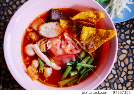 Close up of noodle in pink broth ( Yentafo ) Close up of noodle in pink broth ( Yentafo ) 97367395