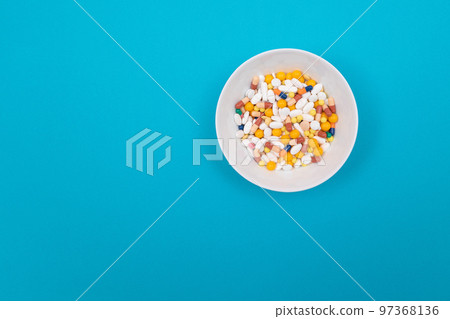 Pharmaceutical Industry and Medicinal Products - Colored Pills in White Dish Pharmaceutical Industry and Medicinal Products - Colored Pills in White Dish 97368136