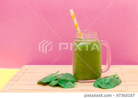 Fresh Green Smoothie of Apple, Celery, and Spinach in Glass Smoothie Jar 97368187