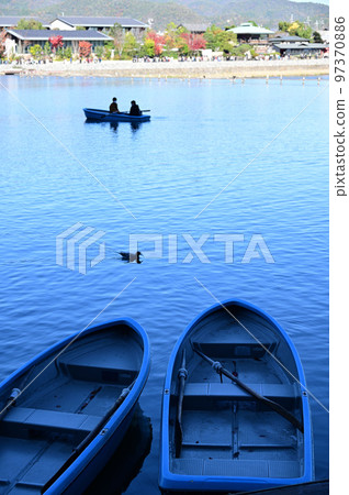 Boat on the Hozu River and scenery on the other side Boat on the Hozu River and scenery on the other side 97370886