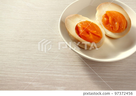 Cross section of seasoned egg (boiled egg) cut in half 97372456