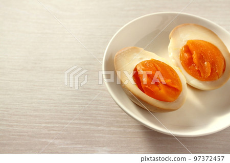 Cross section of seasoned egg (boiled egg) cut in half 97372457