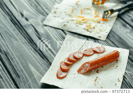 preparation of Shawarma.photo on a wooden background preparation of Shawarma.photo on a wooden background 97372713