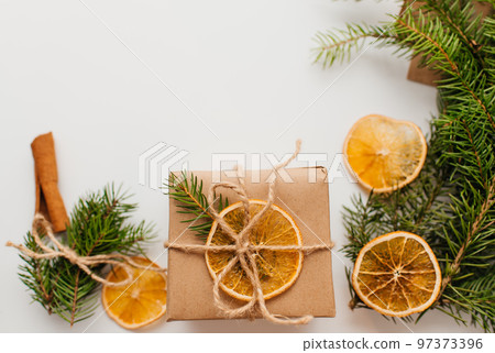 Eco friendly alternative green Xmas gifts wrapped with recycled craft paper. Zero waste Christmas, flat lay, top view Eco friendly alternative green Xmas gifts wrapped with recycled craft paper. Zero waste Christmas, flat lay, top view 97373396