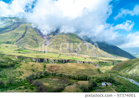 winding mountain roads in the Andes Mountains with a sky overcast with clouds. winding mountain roads in the Andes Mountains with a sky overcast with clouds. 97374001