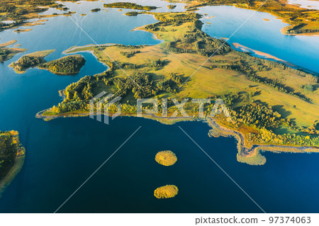 Braslaw Or Braslau, Vitebsk Voblast, Belarus. Aerial View Of Nedrava Lake And Green Forest Landscape In Sunny Autumn Morning. Top View Of Beautiful European Nature From High Attitude. Bird's Eye View Braslaw Or Braslau, Vitebsk Voblast, Belarus. Aerial View Of Nedrava Lake And Green Forest Landscape In Sunny Autumn Morning. Top View Of Beautiful European Nature From High Attitude. Bird's Eye View 97374063