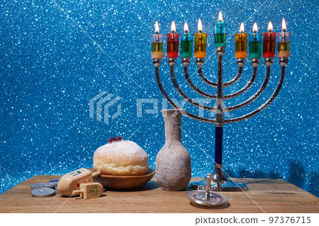 Jewish holiday Hanukkah background with menorah and dreidel with letters Gimel and Nun. Jewish holiday Hanukkah background with menorah and dreidel with letters Gimel and Nun. 97376715