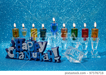 Jewish holiday Hanukkah background with menorah and dreidel with letters Gimel and Nun. 97376718