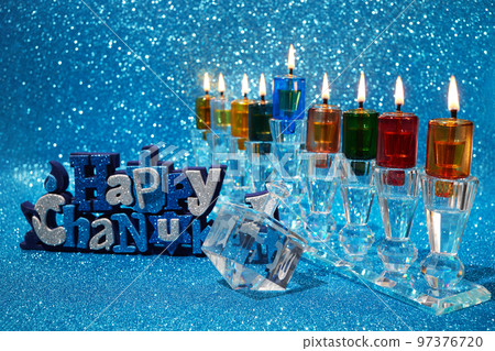 Jewish holiday Hanukkah background with menorah and dreidel with letters Gimel and Nun. Jewish holiday Hanukkah background with menorah and dreidel with letters Gimel and Nun. 97376720