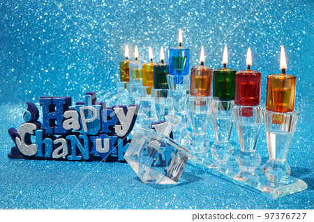 Jewish holiday Hanukkah background with menorah and dreidel with letters Gimel and Nun. Jewish holiday Hanukkah background with menorah and dreidel with letters Gimel and Nun. 97376727