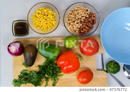 Ingredients for salad with Texas caviar. Vegetable dish with corn, beans, pepper, pepper, tomatoes, beans. Top view Ingredients for salad with Texas caviar. Vegetable dish with corn, beans, pepper, pepper, tomatoes, beans. Top view 97376772