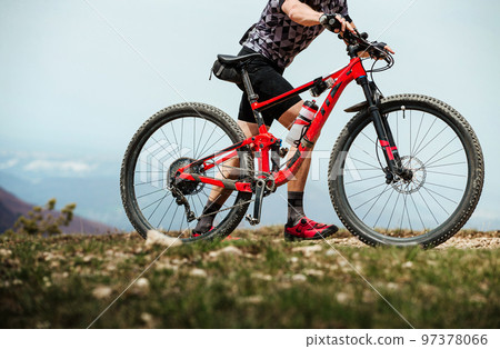 athlete walking with his mountainbike hard climb uphill athlete walking with his mountainbike hard climb uphill 97378066