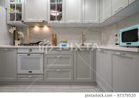 New light grey modern well designed kitchen interior, front view New light grey modern well designed kitchen interior, front view 97379520