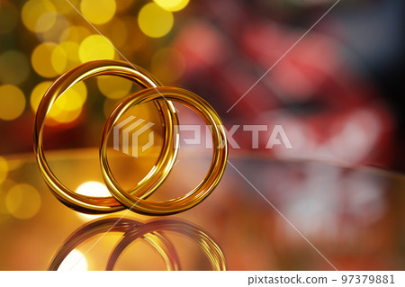3D illustration of two golden rings cuddling together 97379881