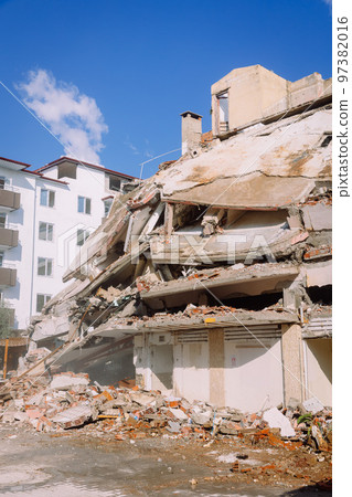 Old house being demolished to build a new one, crushed building 97382016