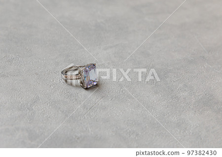 Will you marry me. Wedding ring on concrete stone grey background. Engagement marriage proposal wedding concept. St. Valentine's Day postcard. Banner on valentines day. Copy space 97382430
