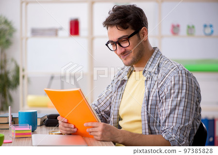 Young male freelancer working from home 97385828