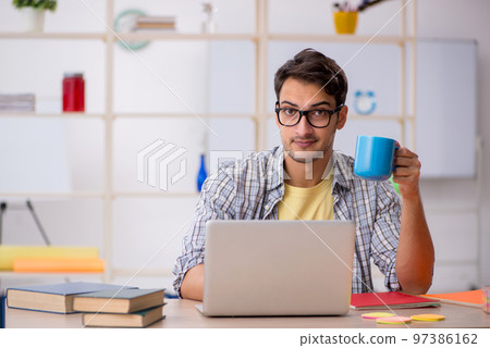 Young male freelancer working from home Young male freelancer working from home 97386162