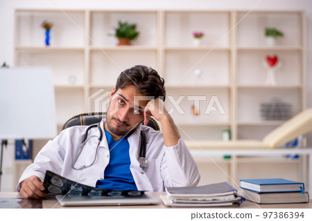 Young male doctor radiologist working in the clinic 97386394