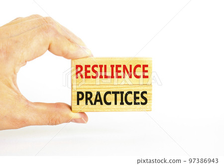 Resilience practices symbol. Concept word Resilience practices typed wooden blocks. Beautiful white table white background. Businessman hand. Business and resilience practices concept. Copy space. 97386943