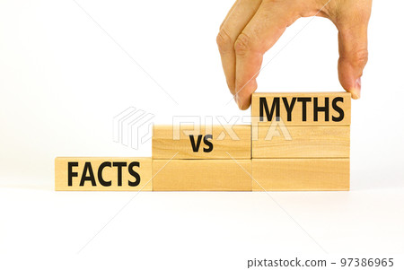 Facts vs myths symbol. Concept words Facts vs myths on wooden blocks on a beautiful white table white background. Businessman hand. Business, finacial and facts vs myths concept. Copy space. 97386965