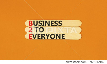 B2E business to everyone symbol. Concept words B2E business to everyone on wooden sticks on a beautiful orange table orange background. Business and B2E business to everyone concept. Copy space. B2E business to everyone symbol. Concept words B2E business to everyone on wooden sticks on a beautiful orange table orange background. Business and B2E business to everyone concept. Copy space. 97386982