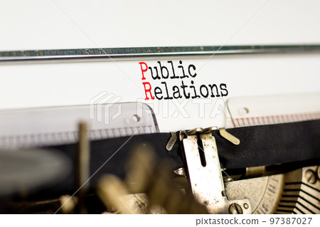 PR public relations symbol. Concept words PR public relations on white paper typed on retro typewriter. Beautiful white background. Copy space. Business and PR public relations concept. 97387027