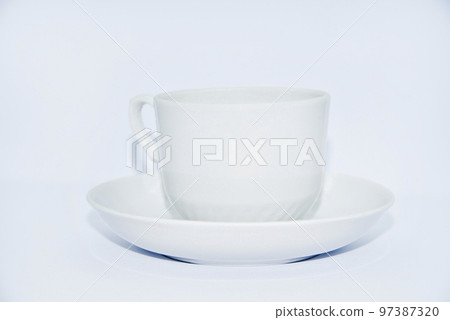 Tea couple on a white background. Porcelain service close-up. A teacup and saucer. Tea couple on a white background. Porcelain service close-up. A teacup and saucer. 97387320