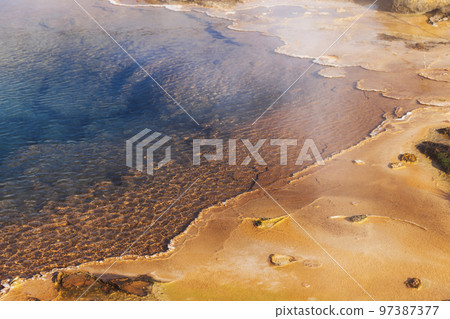 Steam coming up from a hot water spring in Iceland Steam coming up from a hot water spring in Iceland 97387377